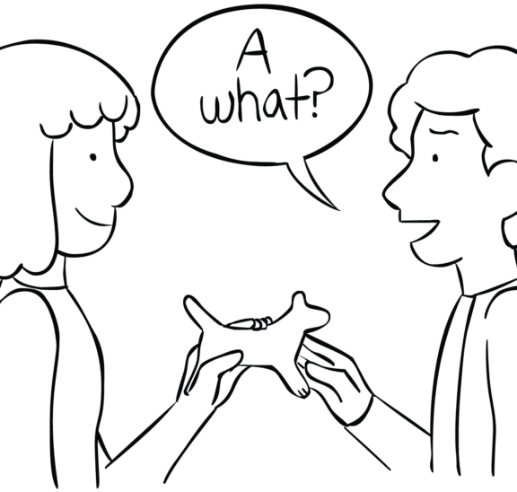 Two people passing an object as part of the circle passing game called A What?