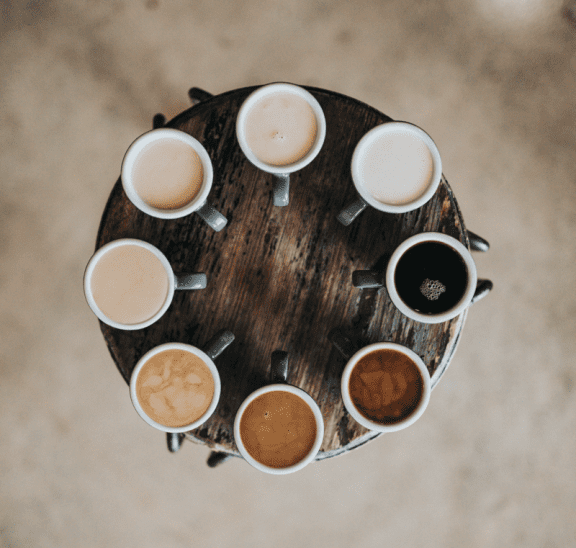 Cups of coffee on a table as part of inclusive diversity team building activities