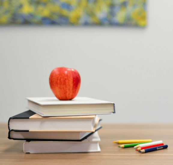 Safe back to school activities scene with books & apple.