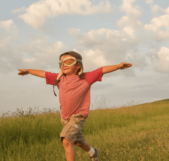 Boy flying with wings, a product of positive education