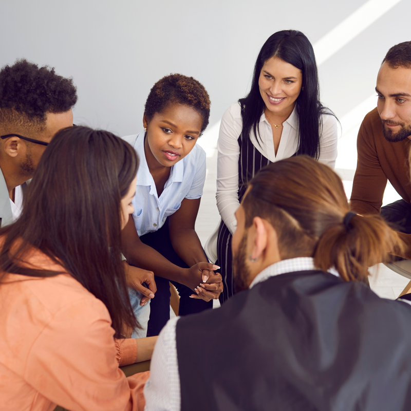 Group sitting in circle discussing something