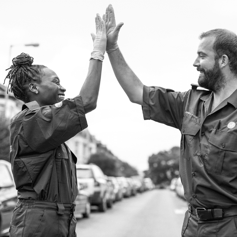 Look for the helpers, man and woman doing high-five. Credit rawpixel