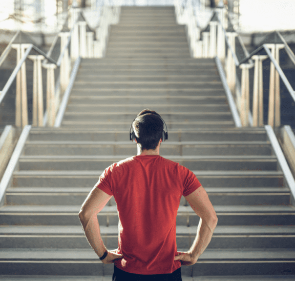 framing is everything for man standing at base of stairs