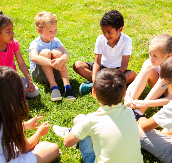 Young children sitting in circle