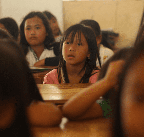 Student looking on at back to school team-building games. Credit Yusril Permana