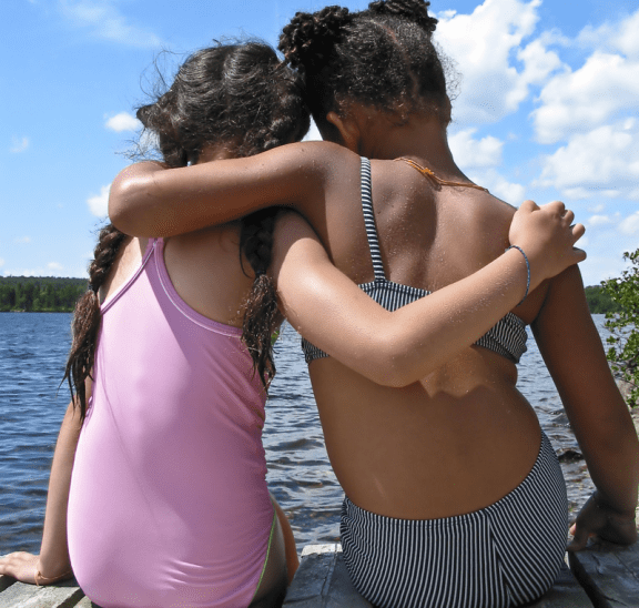 Two girls practising their friendship skills