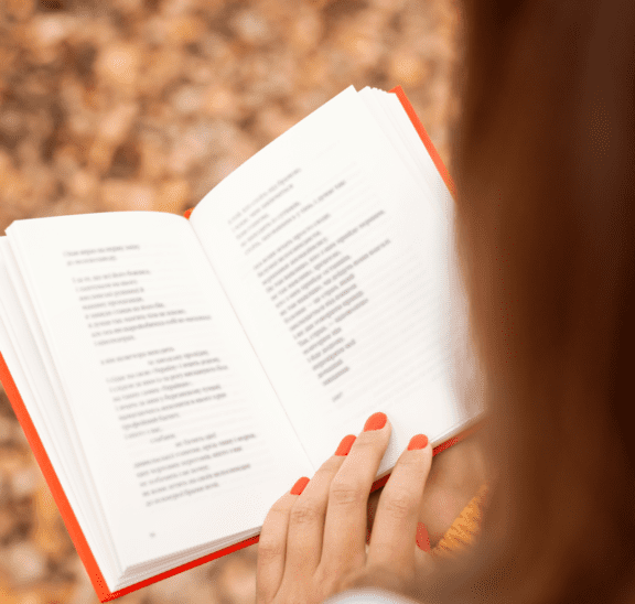 woman reading daily dedications book