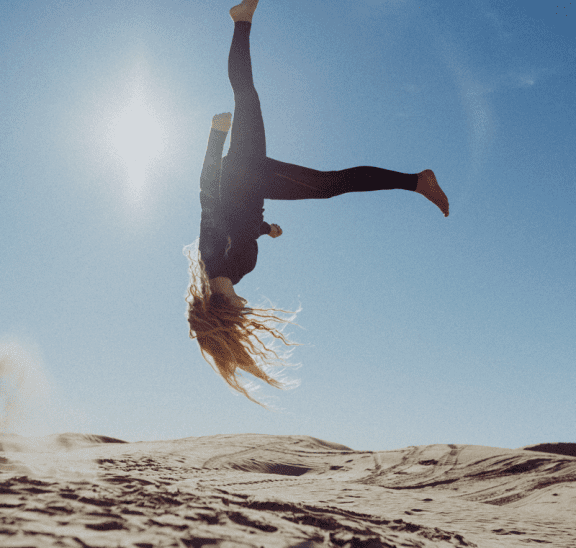 Woman learning by doing back-flip. Credit Persnickety Prints